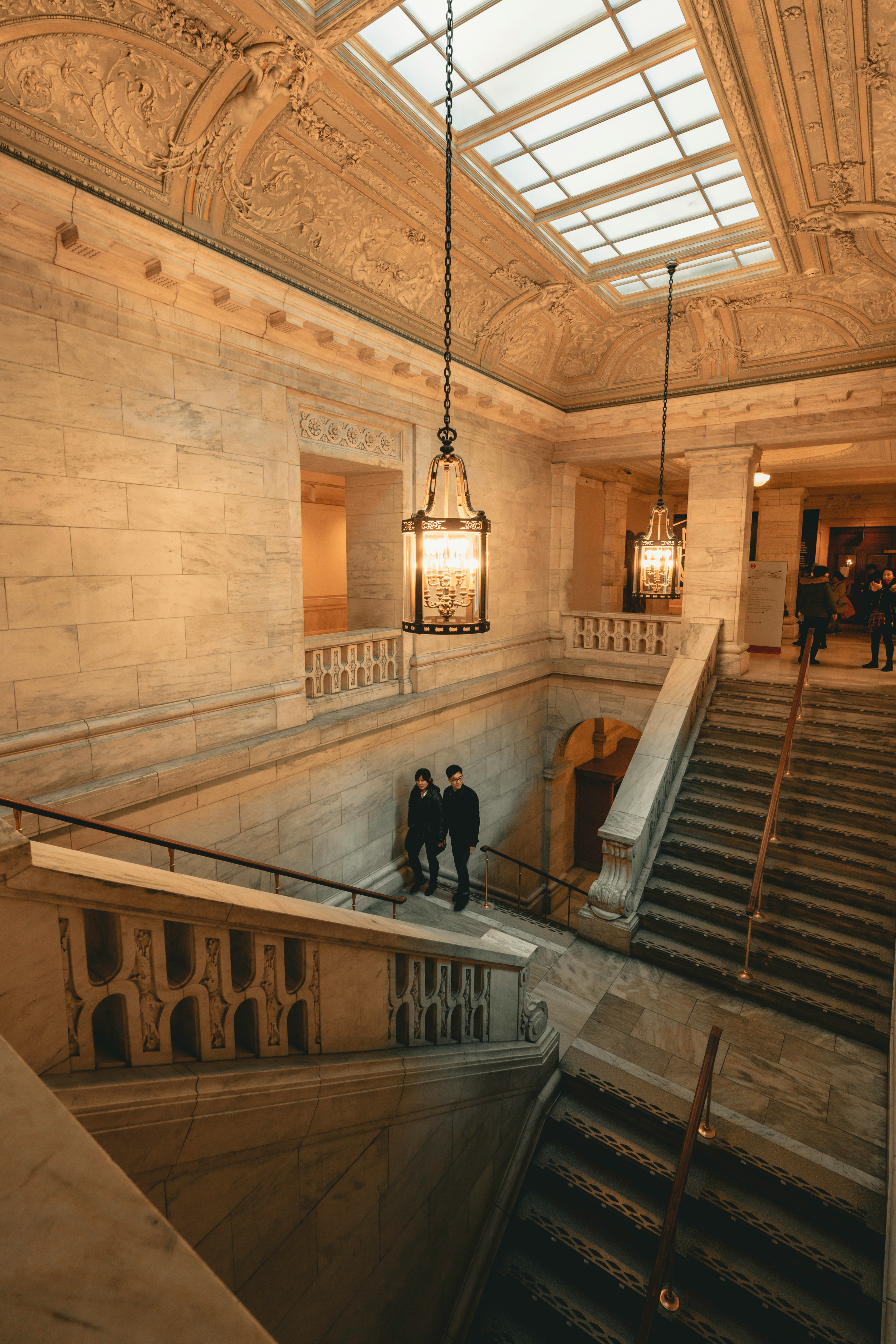 few people walking inside historic building